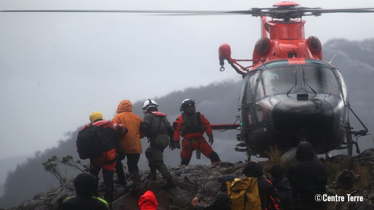 Researchers boarding a helicopter