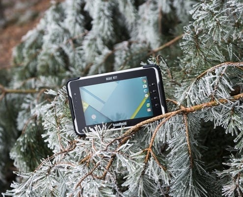 handheld algiz rt7 in a snowy tree