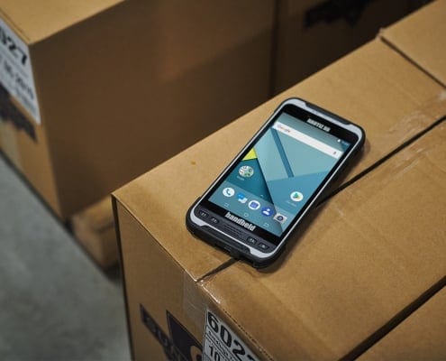 handheld nautiz x6 on boxes in warehouse